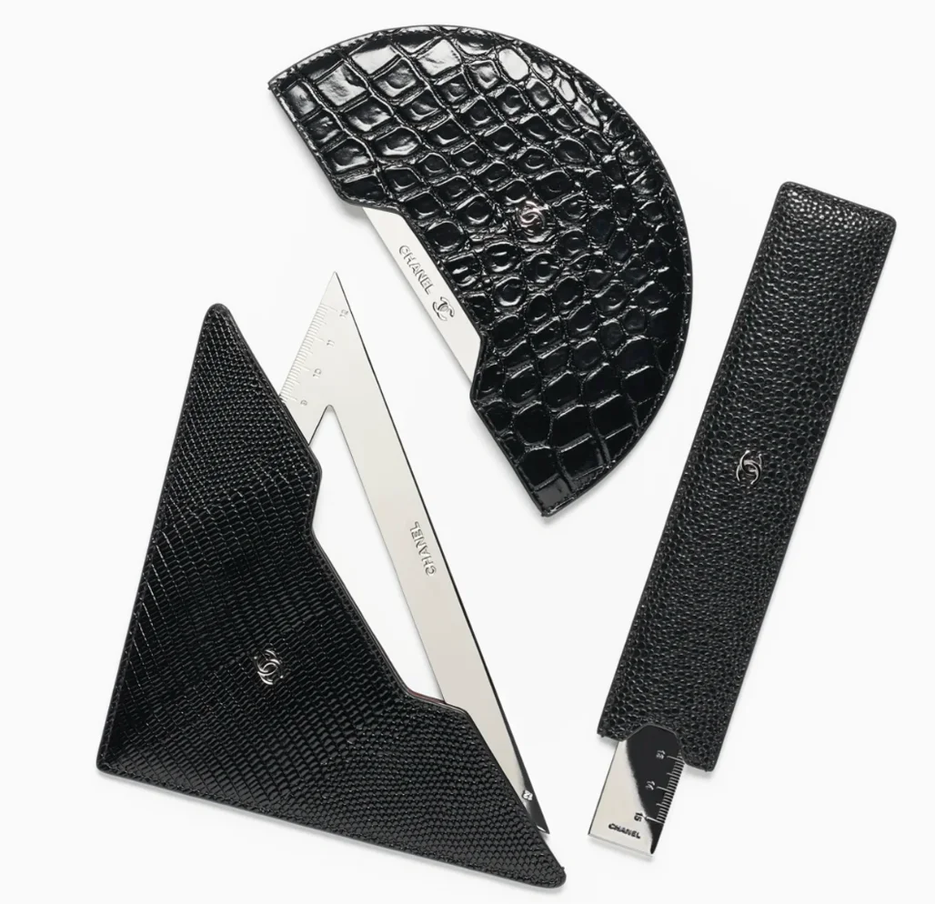 Elegant layout showcasing the CHANEL ruler FW 2026 with a sleek leather pouch