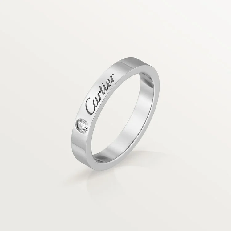 Close-up of a sophisticated couple wearing premium designer wedding bands with exquisite craftsmanship