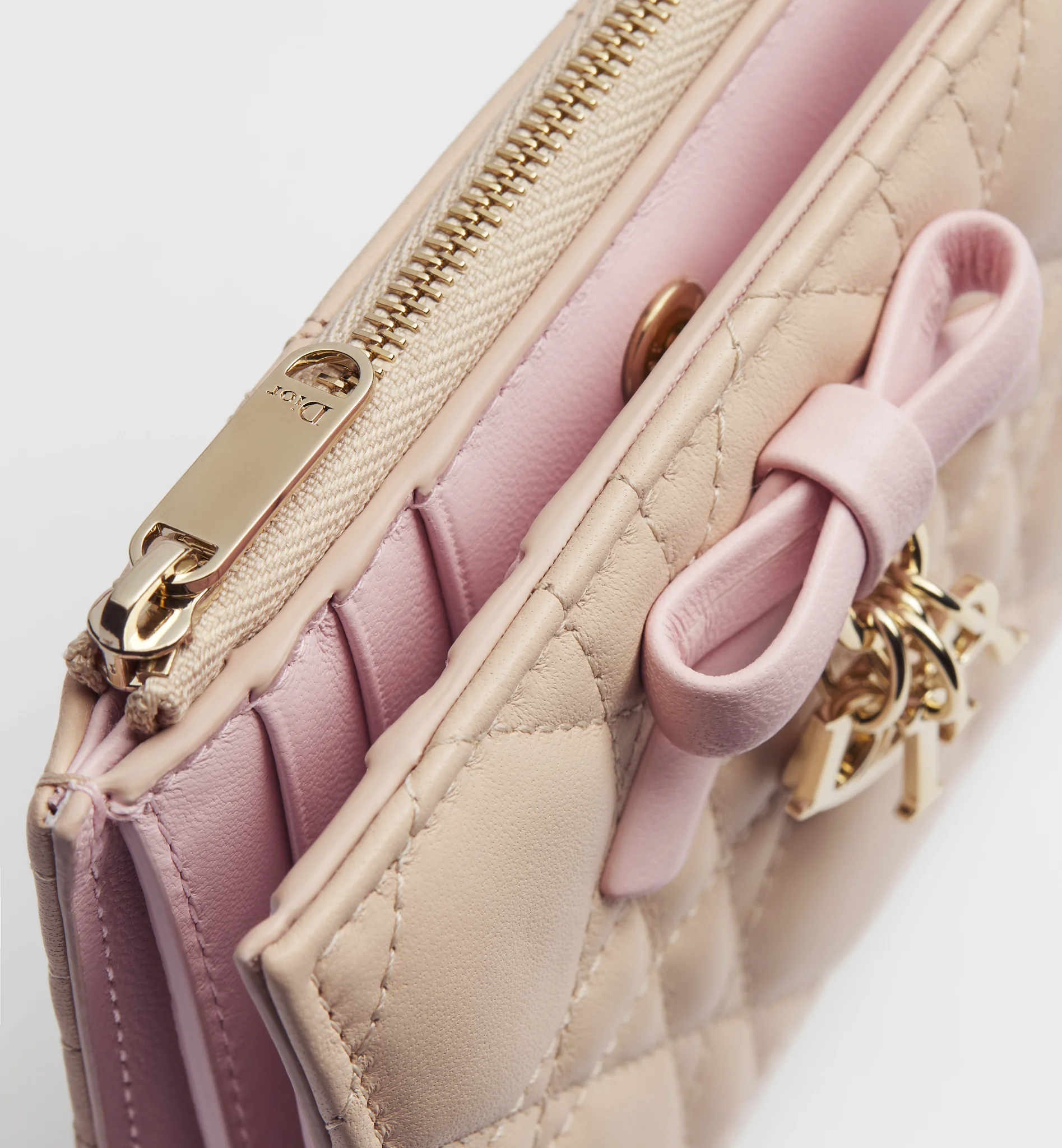 Detailed macro snapshot for an authentic Dior card holder review showing pristine grained leather