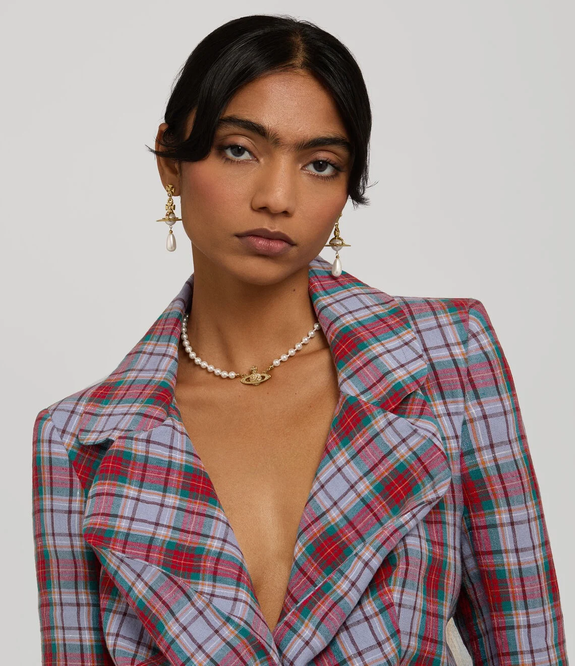 Vivienne Westwood jewelry featuring the iconic Saturn Orb logo design